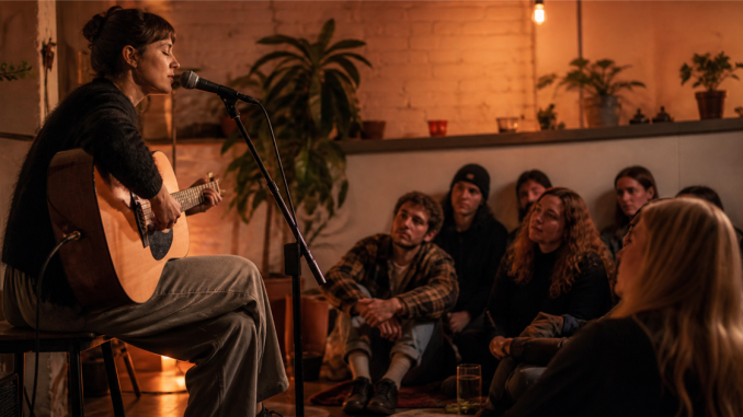 Independent singer-songwriter performing for an attentive small audience