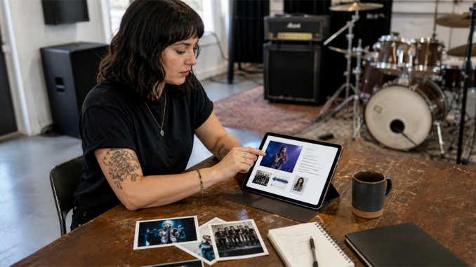 Independent bandleader assembling an electronic press kit in a rehearsal room