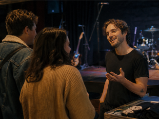 Independent musician talking with listeners after a small performance