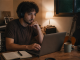 Independent musician writing an email from a quiet home studio