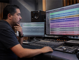 Producer reviewing aligned multitrack stems in a recording studio